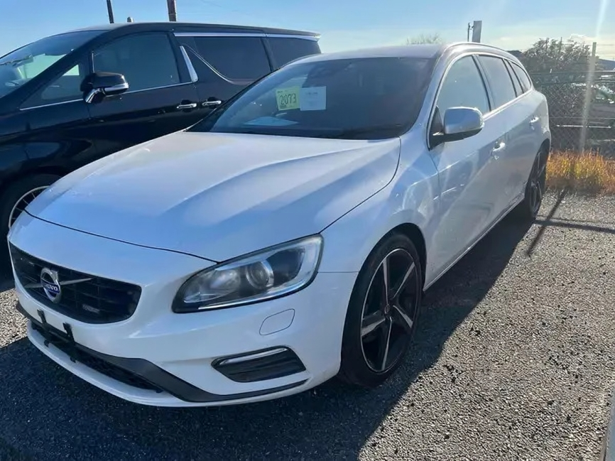 Volvo V60 wagon in white, parked in a lot, representing Nobuko Japan's premium vehicle selection.