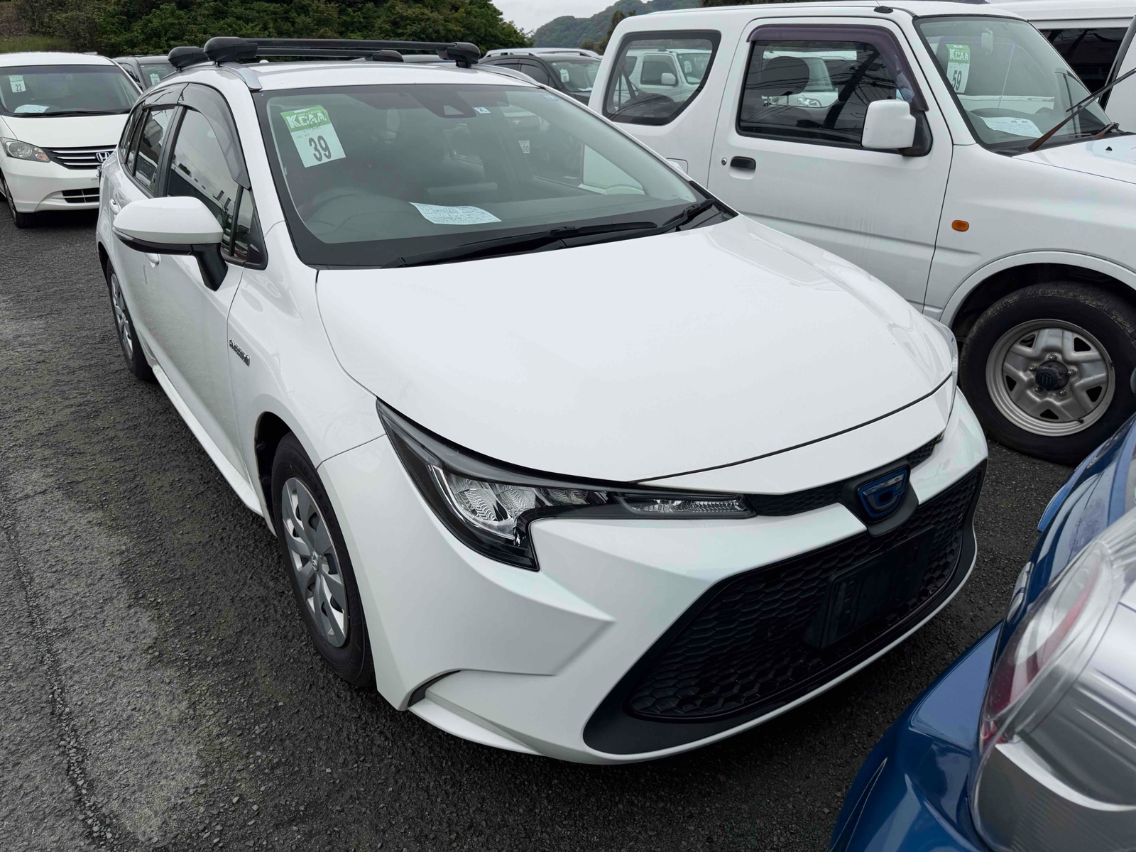 2020 TOYOTA COROLLA TOURING R auction-graded Japanese used car for sale export to United Kingdom 