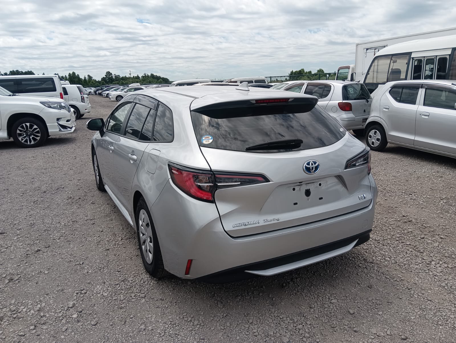 2023 TOYOTA COROLLA TOURING RA auction-graded Japanese used car for sale export to United Kingdom 